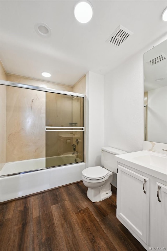 7865 E Mississippi Ave Unit 1504, Denver, CO 80247 - bathroom featuring vanity, shower / bath combination with glass door, wood finished floors, and recessed lighting