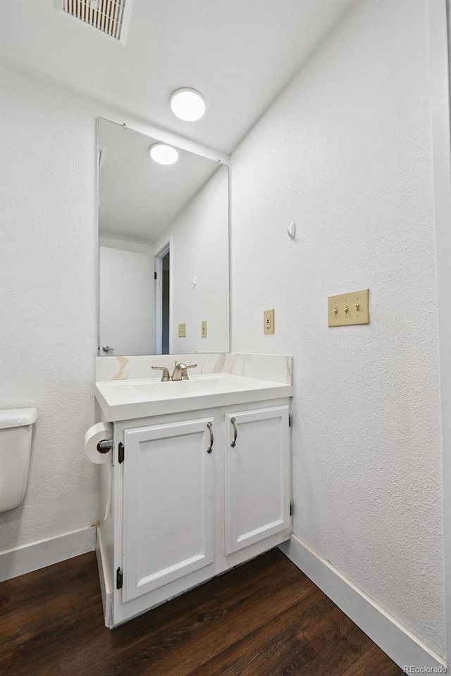 7865 E Mississippi Ave Unit 1504, Denver, CO 80247 - half bath with vanity and wood finished floors