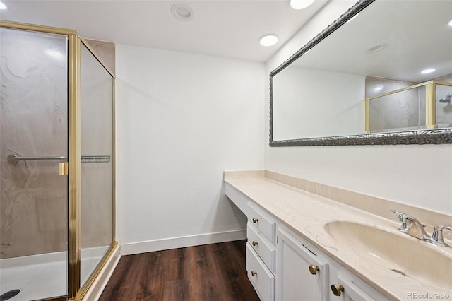 7865 E Mississippi Ave Unit 1504, Denver, CO 80247 - bathroom with a shower stall, vanity, wood finished floors, and recessed lighting