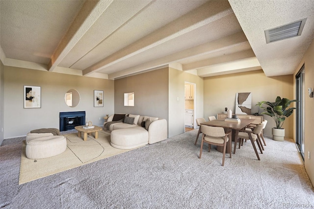 7865 E Mississippi Ave Unit 1504, Denver, CO 80247 - living room with carpet flooring, beam ceiling, and a textured ceiling