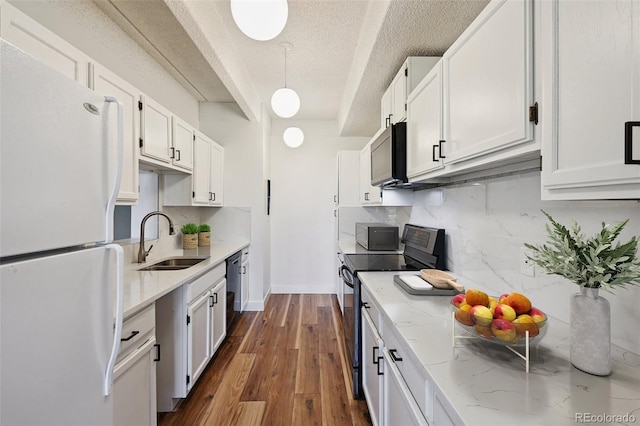 7865 E Mississippi Ave Unit 1504, Denver, CO 80247 - kitchen with freestanding refrigerator, electric range, decorative backsplash, dark wood-style floors, and light stone countertops
