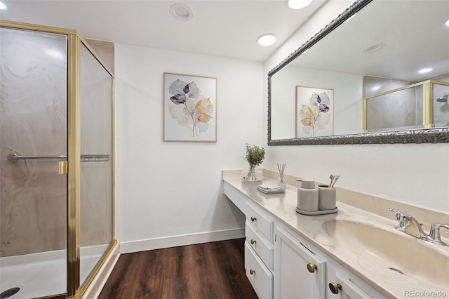 7865 E Mississippi Ave Unit 1504, Denver, CO 80247 - full bath featuring a shower stall, vanity, wood finished floors, and recessed lighting