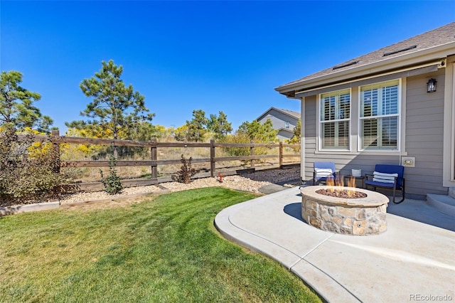 view of yard with a patio and a fire pit