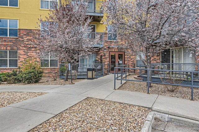 view of home's community featuring fence