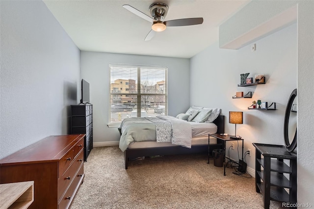 9019 E Panorama Cir Unit D207, Englewood, CO 80112 - carpeted bedroom with baseboards and ceiling fan