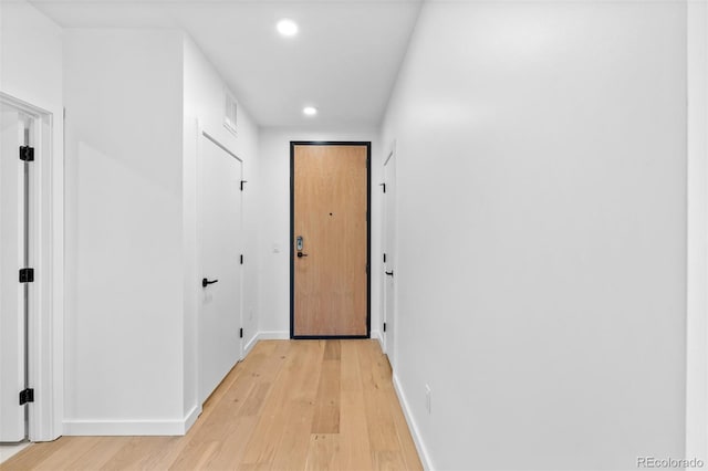 1601 Park Ave Unit 307, Denver, CO 80218 - hall with recessed lighting, light wood-style floors, and baseboards