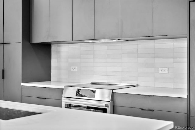 1601 Park Ave Unit 307, Denver, CO 80218 - kitchen featuring gray cabinetry, modern cabinets, stainless steel electric stove, and light countertops