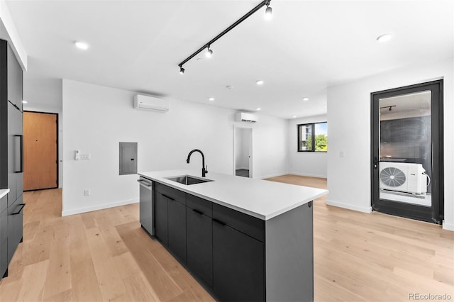 1601 Park Ave Unit 307, Denver, CO 80218 - kitchen featuring a sink, modern cabinets, stainless steel dishwasher, a wall mounted air conditioner, and recessed lighting