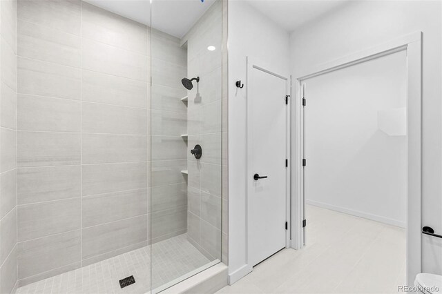 1601 Park Ave Unit 307, Denver, CO 80218 - full bath featuring a shower stall and tile patterned floors