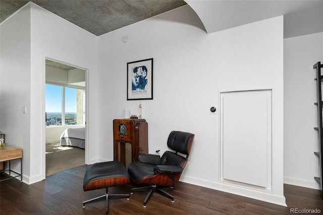 sitting room with wood finished floors and baseboards