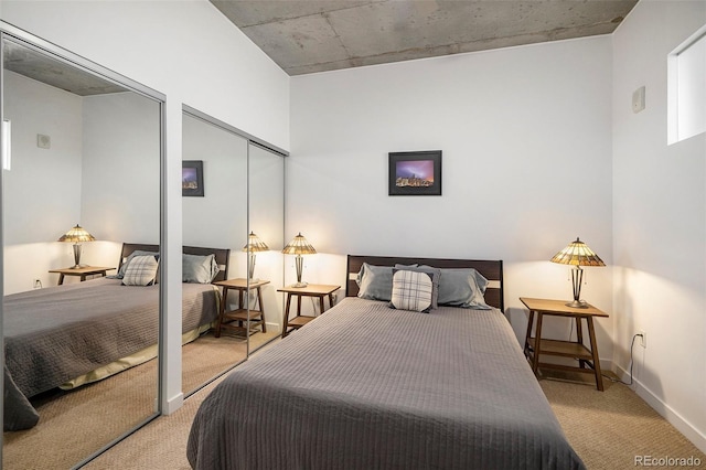 carpeted bedroom featuring baseboards
