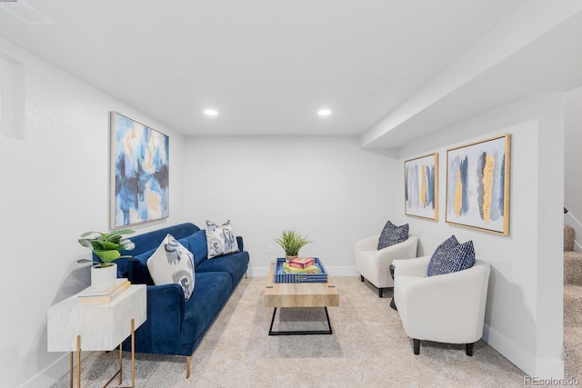 living room with recessed lighting, visible vents, baseboards, and carpet