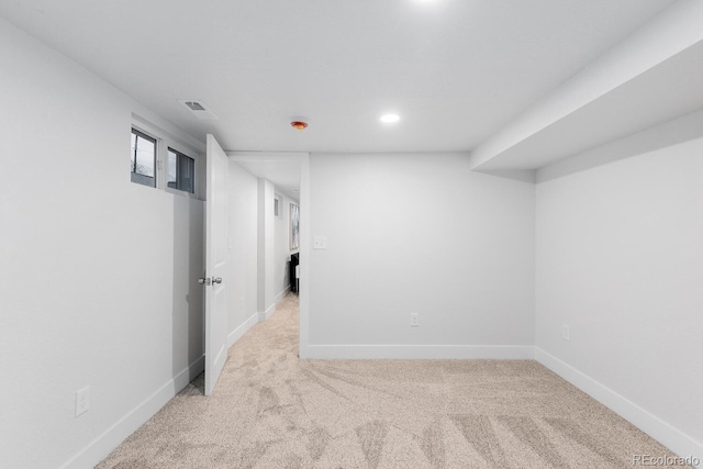 below grade area featuring recessed lighting, carpet flooring, baseboards, and visible vents