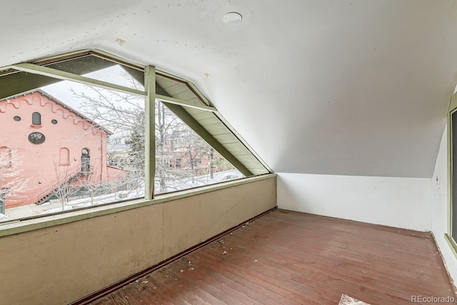 bonus room featuring hardwood / wood-style floors and vaulted ceiling