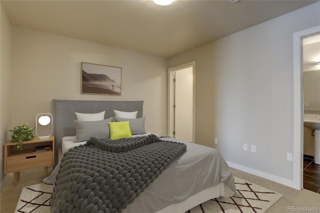 bedroom with carpet flooring and baseboards