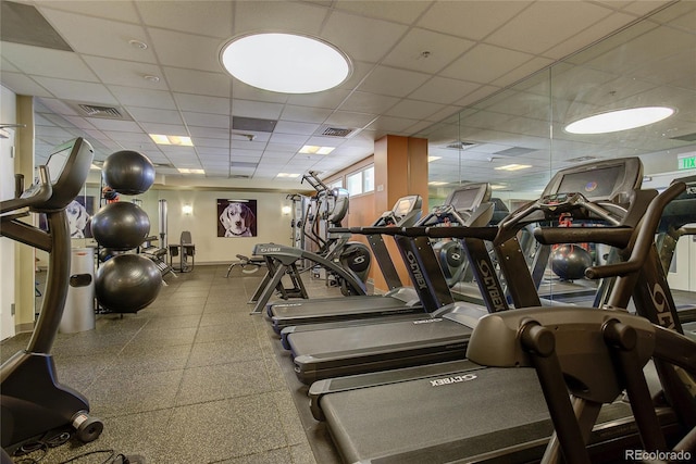 gym with a drop ceiling and visible vents