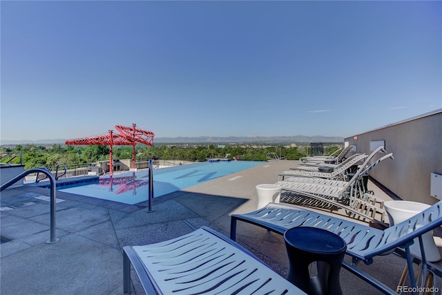 outdoor pool featuring a patio