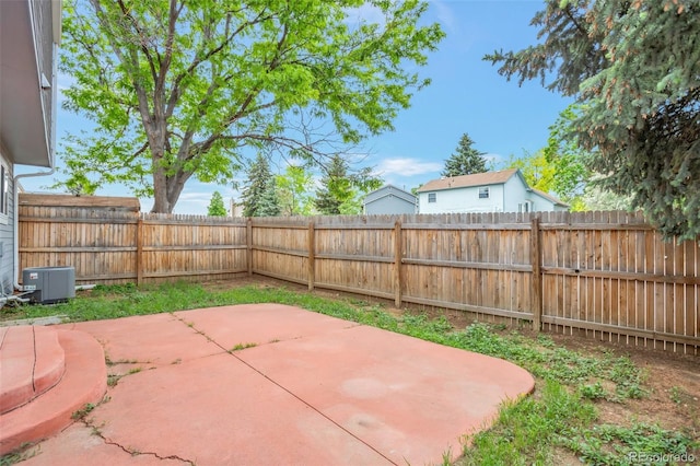 19421 E Milan Cir, Aurora, CO 80013 - fenced backyard with cooling unit and a patio area