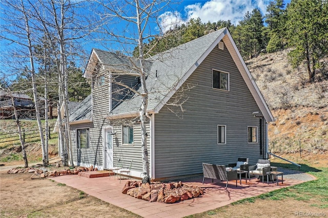 back of property featuring a patio area