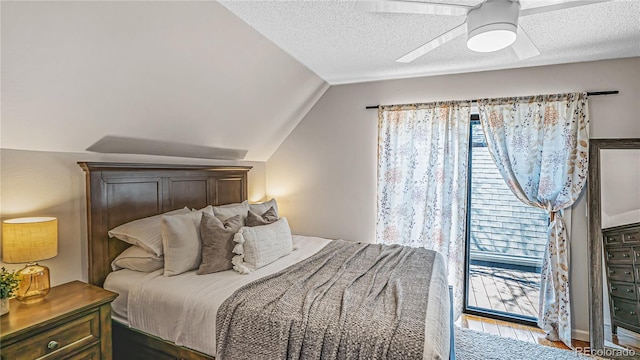 bedroom featuring vaulted ceiling, light hardwood / wood-style flooring, multiple windows, and ceiling fan