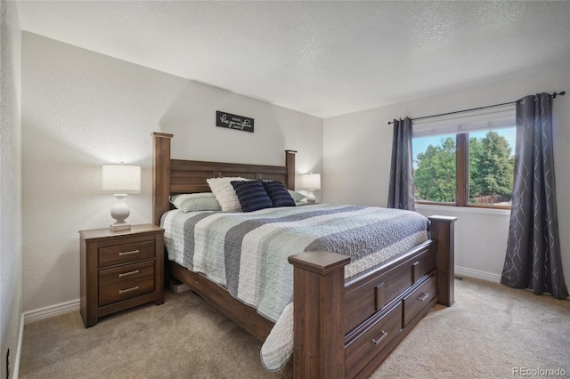 carpeted bedroom featuring a textured ceiling