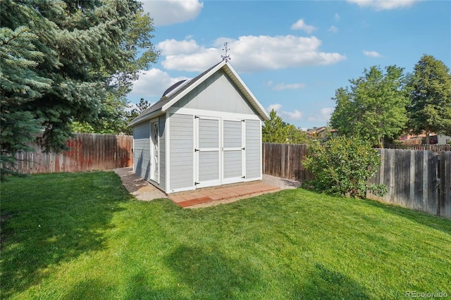 view of outdoor structure featuring a yard