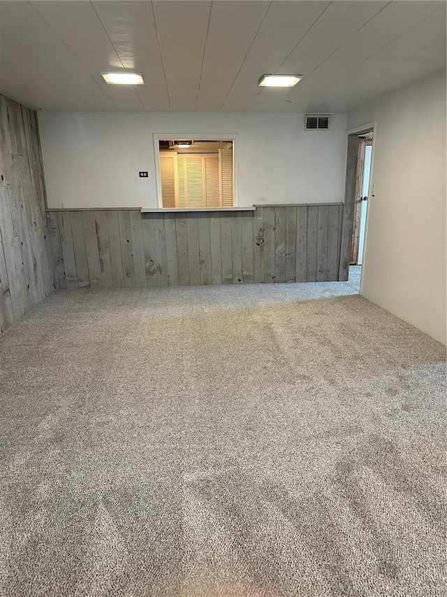 below grade area with carpet and visible vents