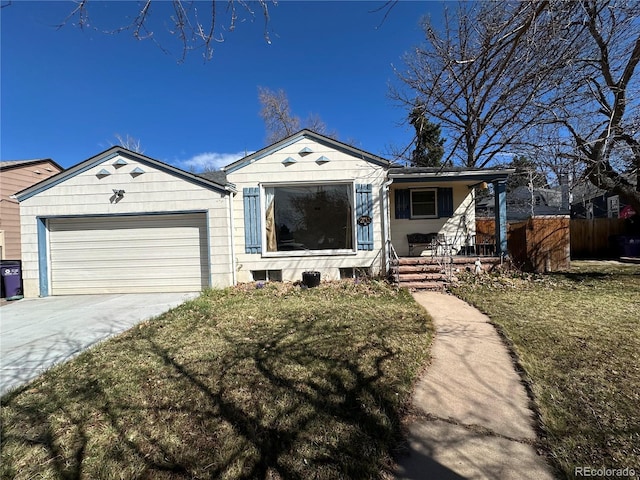 view of front of home featuring a front lawn, driveway, fence, a porch, and a garage