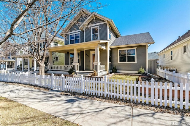 view of front of house with a fenced front yard and covered porch