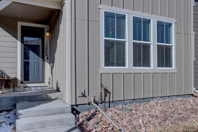 entrance to property featuring board and batten siding