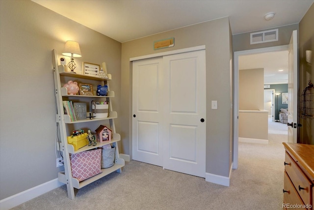 game room with visible vents, light carpet, and baseboards