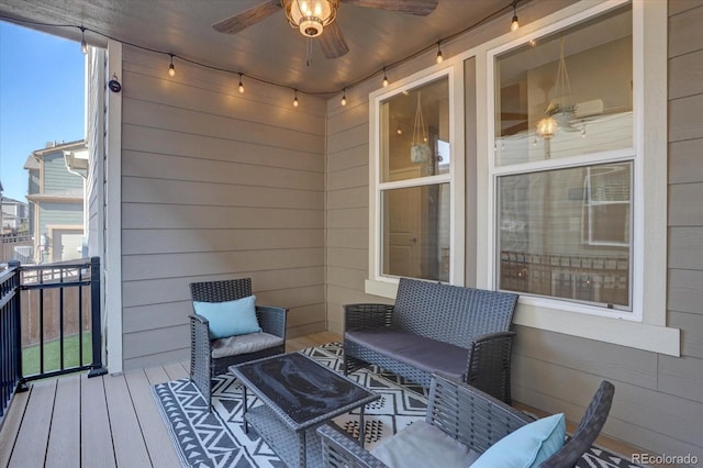 wooden deck featuring ceiling fan