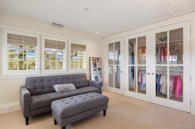67 Indigo Way, Castle Rock, CO 80108 - living area with light carpet, french doors, and recessed lighting