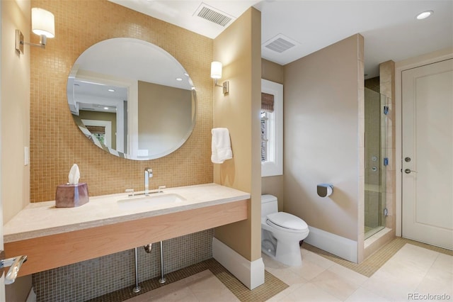 67 Indigo Way, Castle Rock, CO 80108 - full bath featuring a sink, toilet, a shower stall, tile patterned floors, and baseboards