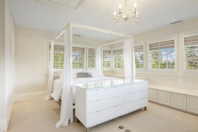 67 Indigo Way, Castle Rock, CO 80108 - bedroom featuring light carpet, baseboards, and a chandelier