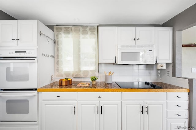 5740 S Cherokee St, Littleton, CO 80120 - kitchen with white appliances, decorative backsplash, and white cabinetry