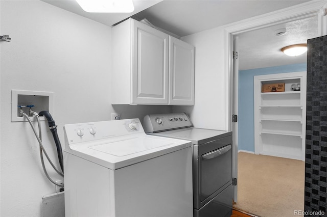5740 S Cherokee St, Littleton, CO 80120 - washroom with cabinet space, washing machine and clothes dryer, and carpet