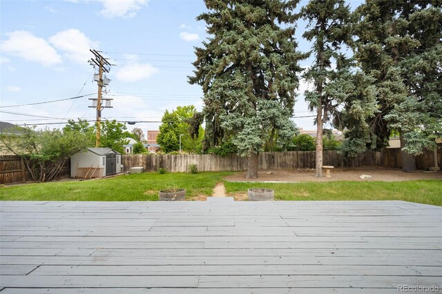 5740 S Cherokee St, Littleton, CO 80120 - wooden terrace with a shed and a fenced backyard