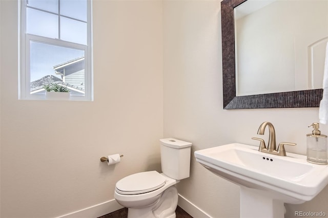 15705 Red Deer Dr, Morrison, CO 80465 - half bath with baseboards, a sink, and toilet