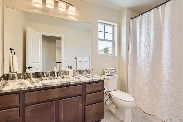 15705 Red Deer Dr, Morrison, CO 80465 - bathroom with toilet, tile patterned floors, and vanity