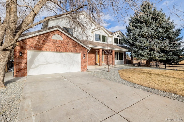 front facade with a garage and a front lawn