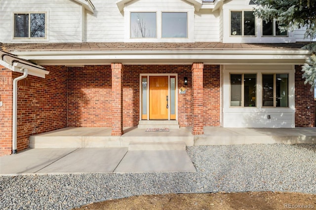 view of exterior entry with covered porch