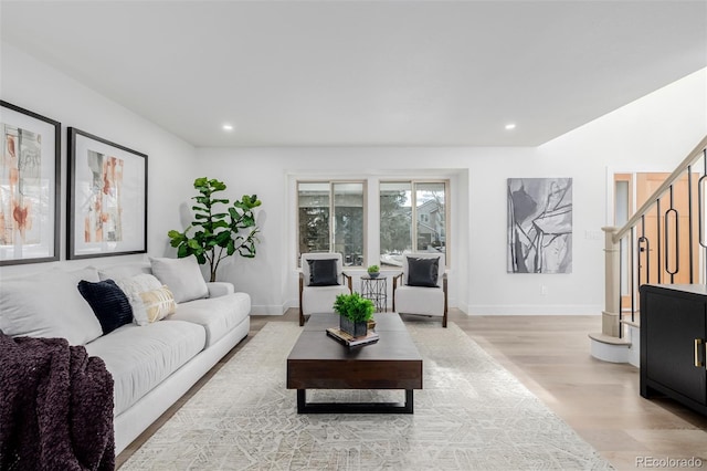 living room with light hardwood / wood-style flooring