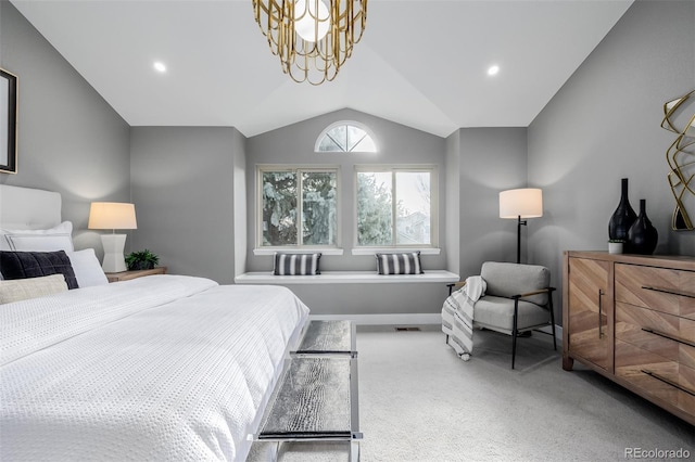 bedroom with lofted ceiling, carpet flooring, and a chandelier