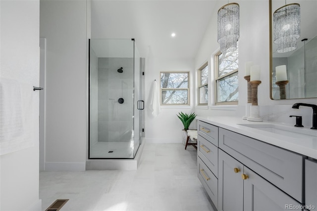 bathroom featuring vanity and walk in shower