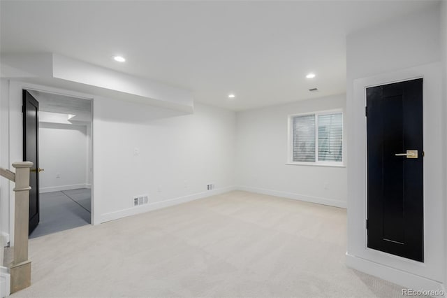 basement with light colored carpet