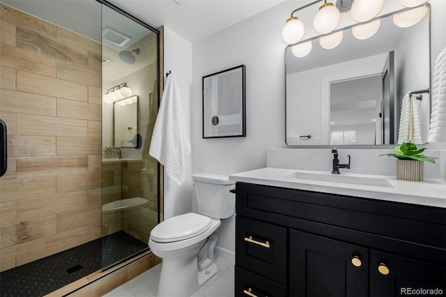 bathroom featuring a shower with door, vanity, and toilet