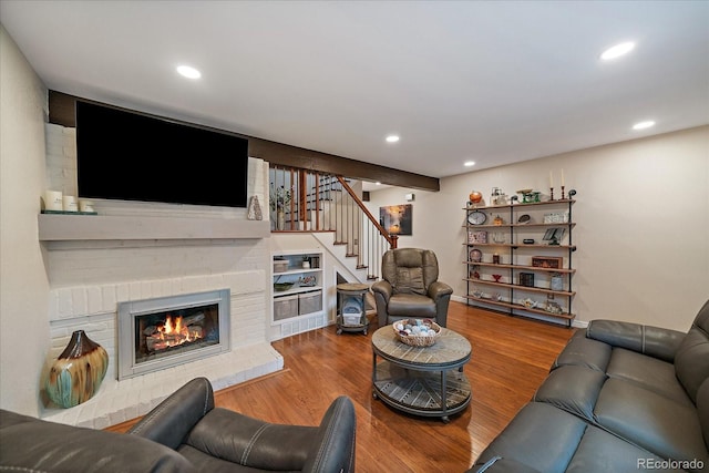 6936 S Knolls Way, Centennial, CO 80122 - living area featuring stairway, wood finished floors, recessed lighting, and a brick fireplace