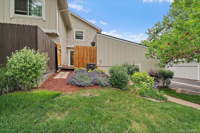 6936 S Knolls Way, Centennial, CO 80122 - view of yard with a garage and central air condition unit