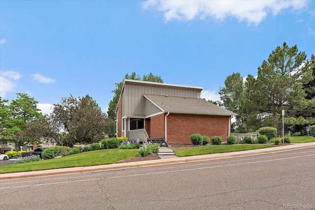 6936 S Knolls Way, Centennial, CO 80122 - mid-century home with brick siding and a front lawn